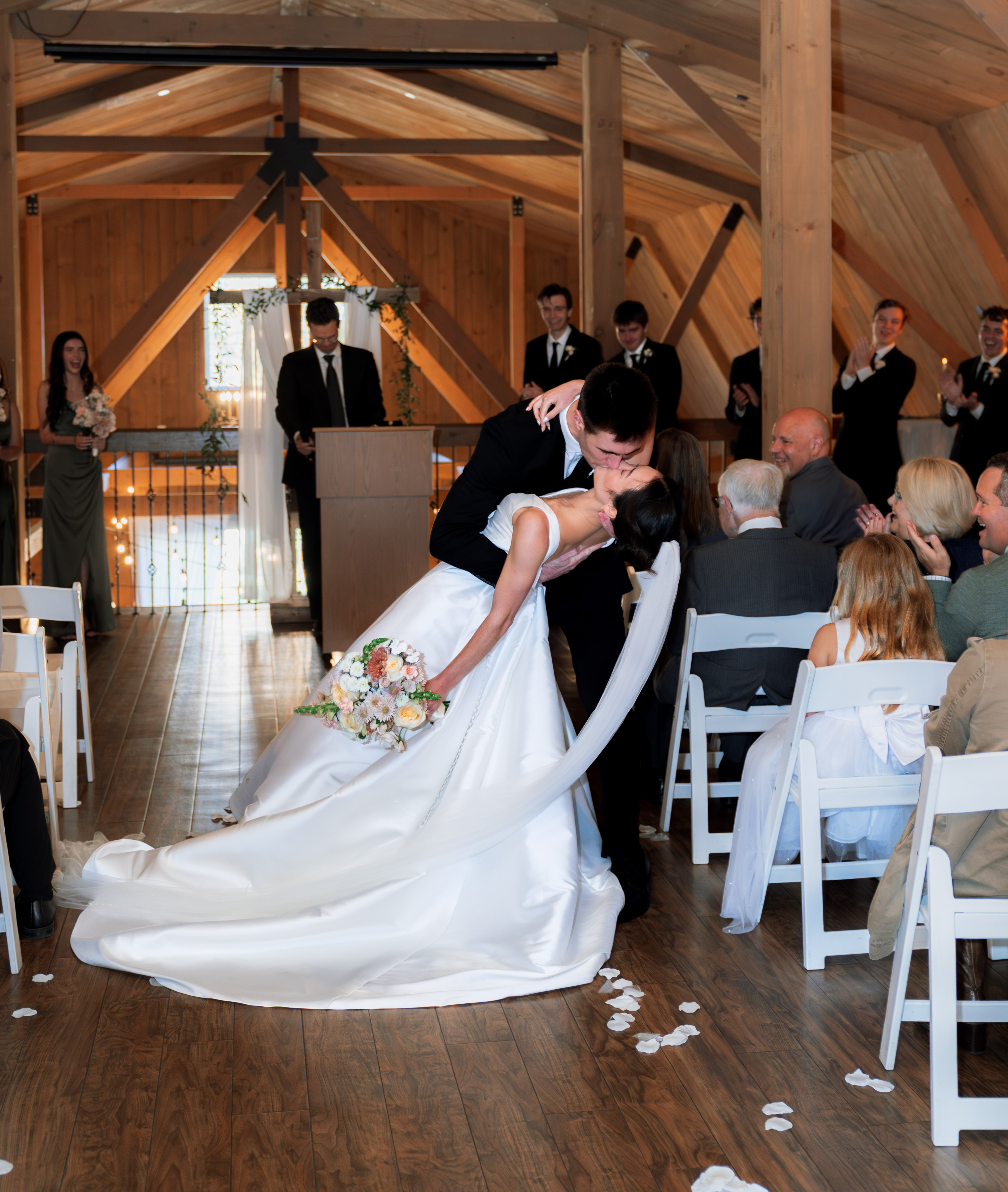 First kiss ceremony in rustic barn at Rustic Manor
