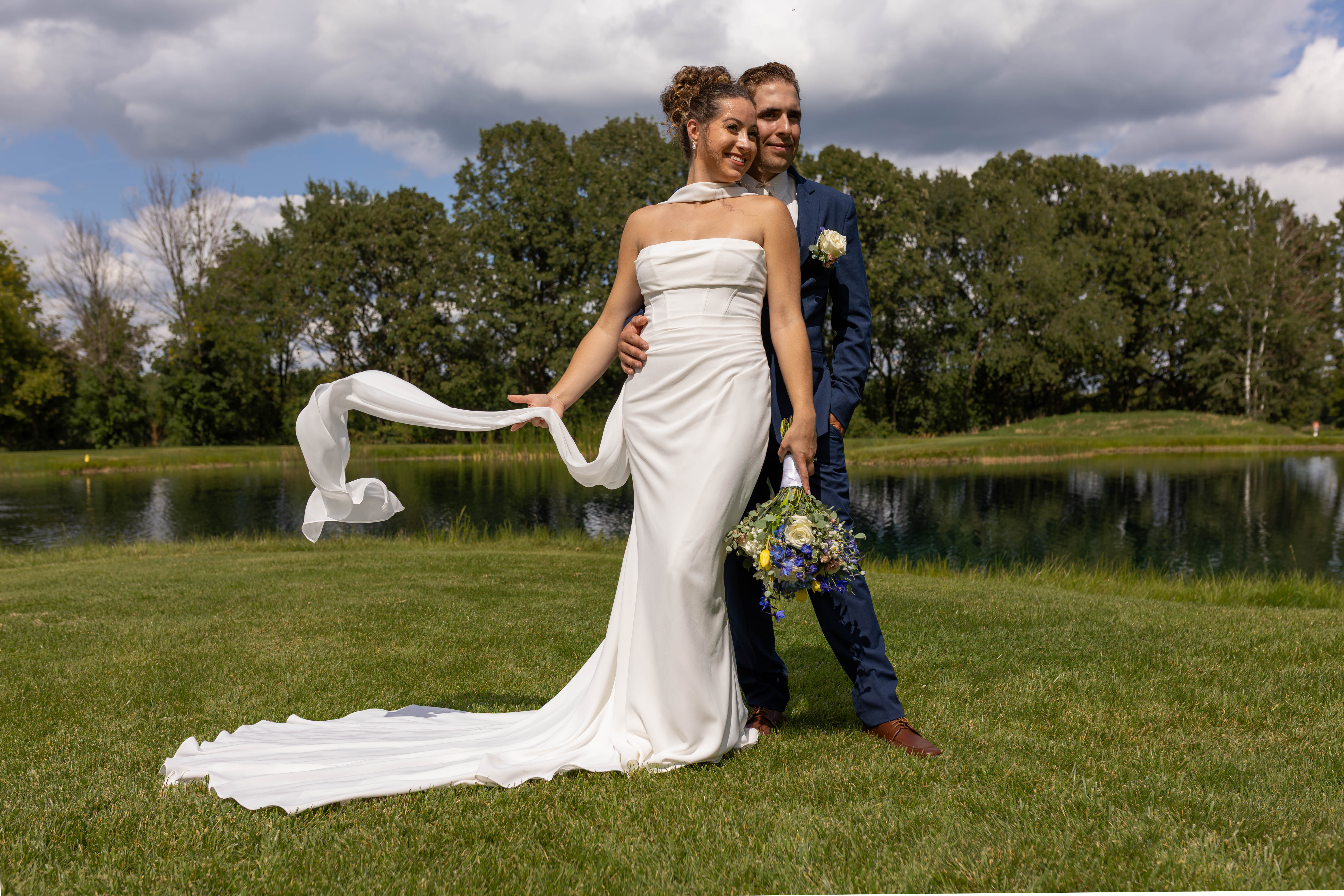 Romantic couple portrait at golden hour by the lake